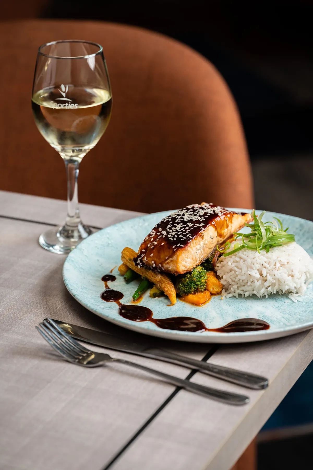 Glazed fish fillet with rice and a rich sauce