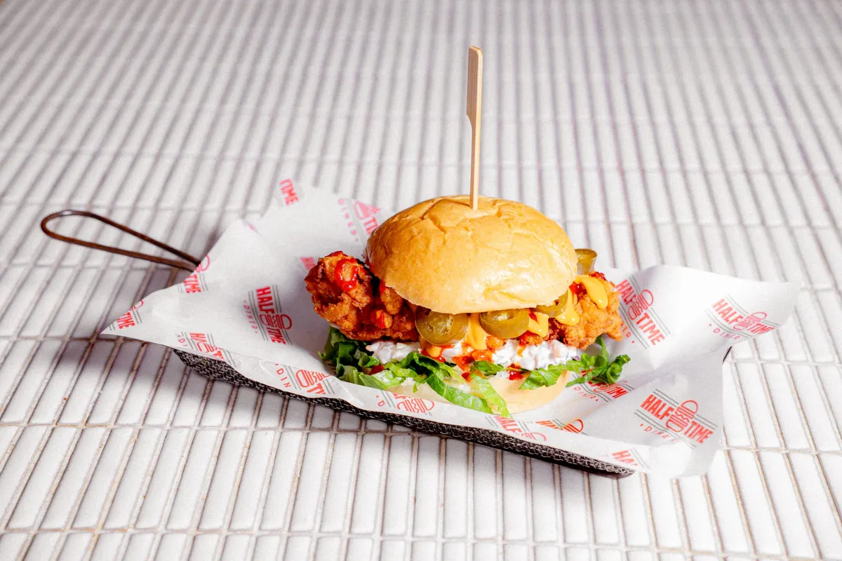 Crispy chicken burger with pickles and slaw
