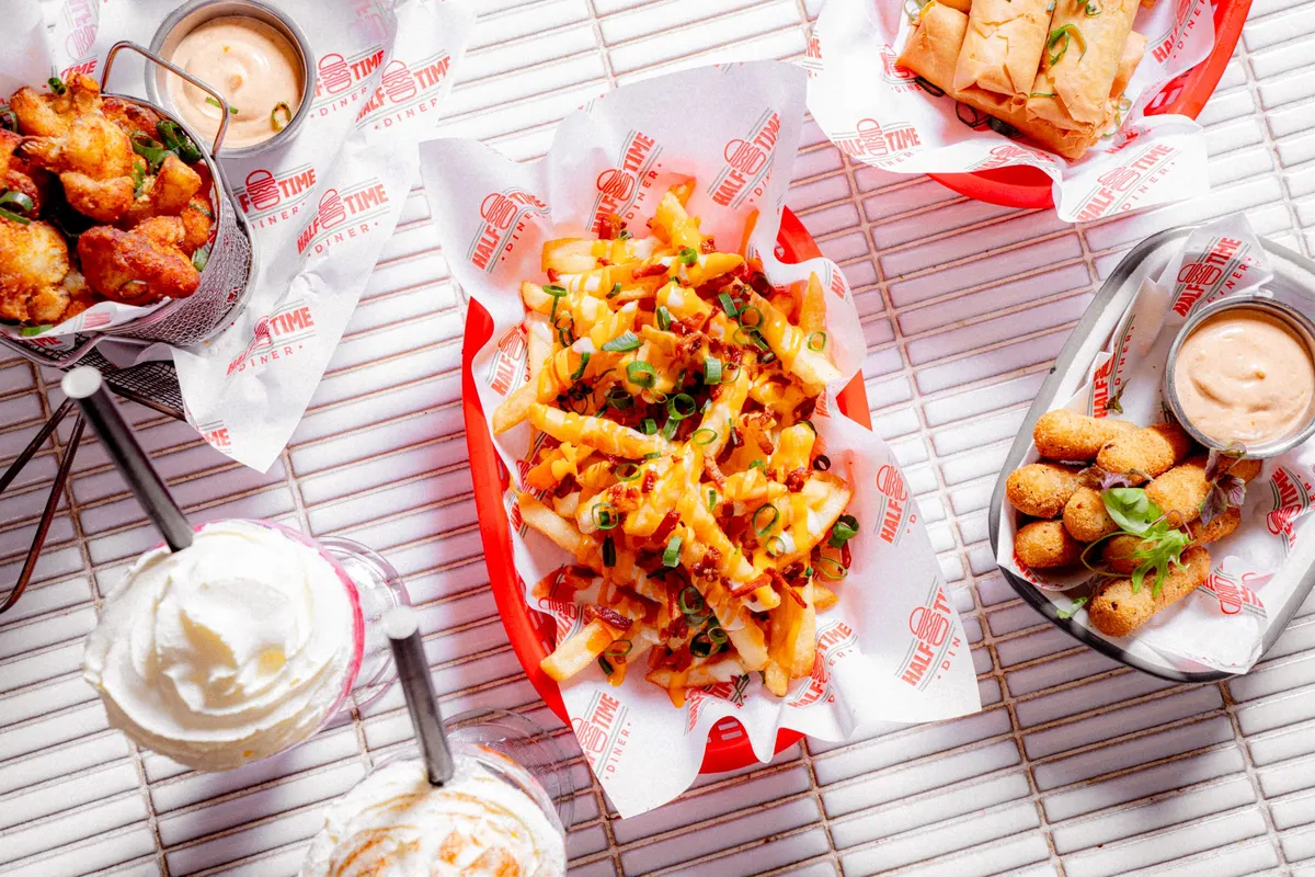 Loaded fries, chicken bites and a sundae from above
