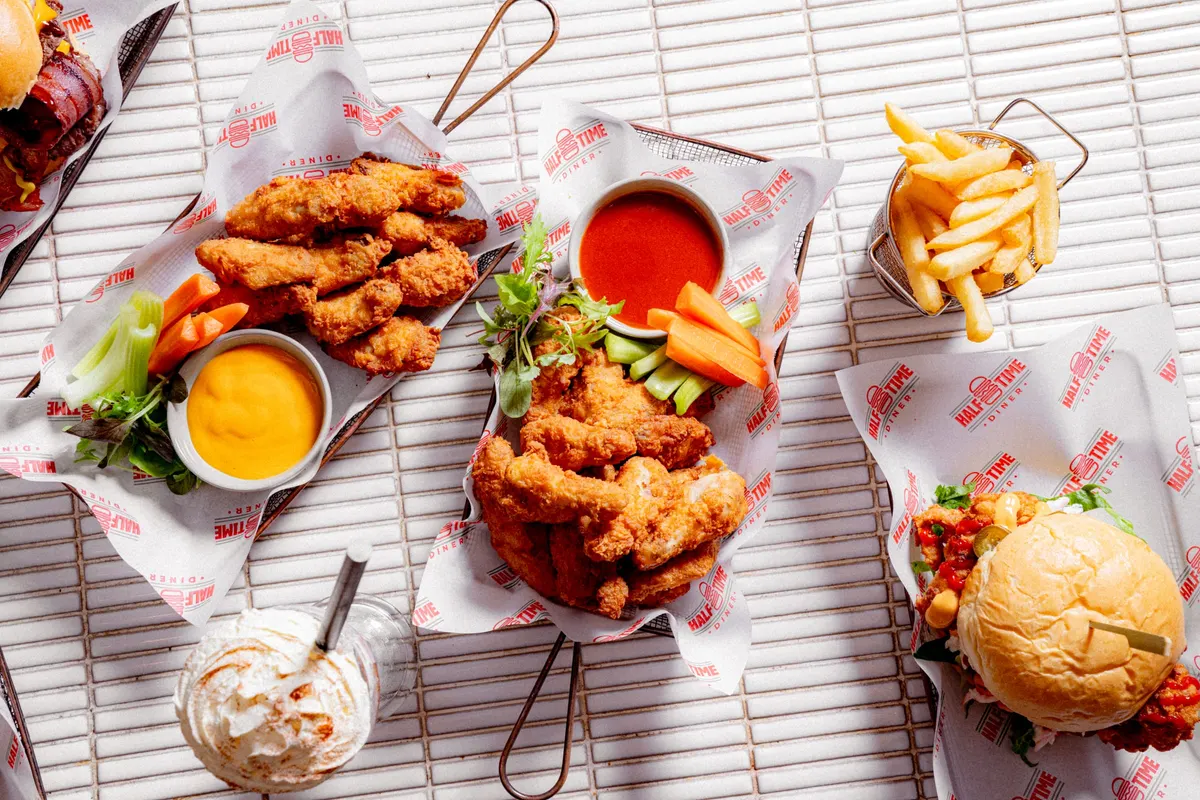 Chicken tenders, burger and fries with dipping sauces