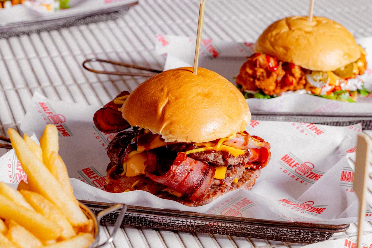 Smash burger with fries on diner paper