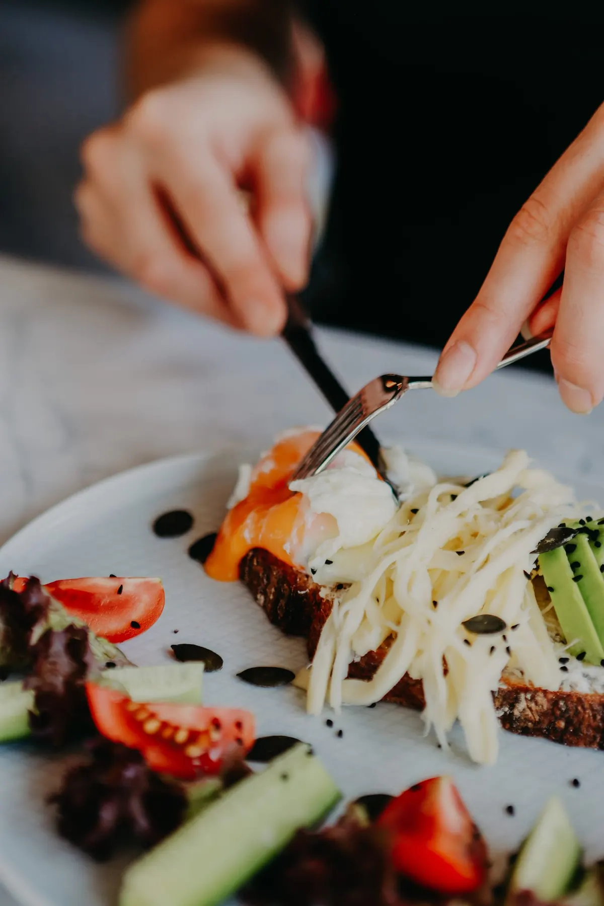 Chef finishing a plate with a delicate garnish