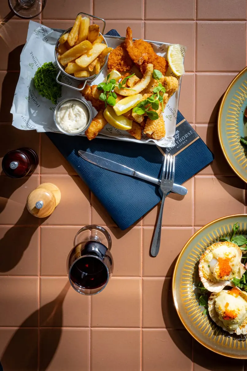 Loaded fries and eggs on a tiled table
